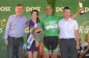 27 May 2012; Gediminas Bagdonas, An Post Sean Kelly team, is presented with the An Post points leader jersey and Kieran McMahon trophy by An Post Chief Executive Donal Connell, Cian Lynch, right, and Miss An Post Rás Skerries Isabel Cooke following the 2012 An Post Rás. Cootehill - Skerries. Picture credit: Stephen McCarthy / SPORTSFILE