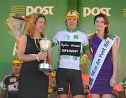 27 May 2012; Richard Handley, Rapha Condor Sharp, is presented with his Irish Sports Council leading U23 rider jersey and Ben McKenna Cup by Gillian Costello, Irish Sports Council, and Miss An Post Rás Isabele Cooke following the eight stage of the 2012 An Post Rás. Cootehill - Skerries. Picture credit: Stephen McCarthy / SPORTSFILE