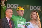 22 May 2012; Gediminas Bagdonas, An Post Sean Kelly team, is presented with his An Post points leader green jersey by Eamonn Gannon, Branch Manager, An Post, Westport, and Miss An Post Rás Westport Aoife McGreal following the third stage of the 2012 An Post Rás, into Westport, Co. Mayo. Gort - Westport. Picture credit: Diarmuid Greene / SPORTSFILE