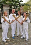 6 June 2012; Special Olympics Ireland volunteers from left, Pamela Lacken, Brian Brunton and Alva Nolan along with athlete Gary O'Brien who helped to light the way for Ireland’s Olympic hopefuls by carrying the Olympic Flame during the London 2012 Olympic Torch Relay in Dublin. Mansion House, Dawson St., Dublin. Picture credit: Barry Cregg / SPORTSFILE