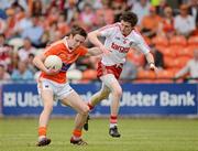 10 June 2012; Ciaran O'Hanlon, Armagh, in action against Rory Brennan, Tyrone. Electric Ireland Ulster GAA Football Minor Championship, Quarter-Final, Armagh v Tyrone, Morgan Athletic Grounds, Armagh. Picture credit: Oliver McVeigh / SPORTSFILE