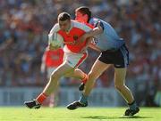 1 September 2002; Oisin McConville of Armagh in action against Barry Cahill of Dublin during the Bank of Ireland All-Ireland Senior Football Championship Semi-Final match between Armagh and Dublin at Croke Park in Dublin. Photo by Ray McManus/Sportsfile