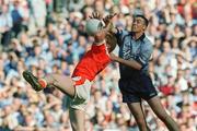 1 September 2002; Ray Cosgrove of Dublin in action against Francis Bellew of Armagh during the Bank of Ireland All-Ireland Senior Football Championship Semi-Final match between Armagh and Dublin at Croke Park in Dublin. Photo by Pat Murphy/Sportsfile