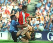1 September 2002; Paddy McKeever of Armagh slides in ahead of Paul Casey of Dublin to score his side's first goal during the Bank of Ireland All-Ireland Senior Football Championship Semi-Final match between Armagh and Dublin at Croke Park in Dublin. Photo by Pat Murphy/Sportsfile