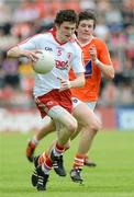 10 June 2012; Rory Brennan, Tyrone, in action against Joseph McElroy, Armagh. Electric Ireland Ulster GAA Football Minor Championship, Quarter-Final, Armagh v Tyrone, Morgan Athletic Grounds, Armagh. Picture credit: Brian Lawless / SPORTSFILE