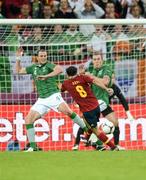 14 June 2012; Spain's Xavi Hernández has his shot on goal closed down by the Republic of Ireland's John O'Shea, left, and Richard Dunne. EURO2012, Group C, Spain v Republic of Ireland, Arena Gdansk, Gdansk, Poland. Picture credit: David Maher / SPORTSFILE
