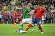 14 June 2012; Fernando Torres, Spain, goes past the challenge of Richard Dunne, Republic of Ireland, on his way to scoring his side's first goal after four minutes. EURO2012, Group C, Spain v Republic of Ireland, Arena Gdansk, Gdansk, Poland. Picture credit: Pat Murphy / SPORTSFILE