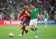 14 June 2012; Keith Andrews, Republic of Ireland, in action against Gerard Piqué, Spain. EURO2012, Group C, Spain v Republic of Ireland, Arena Gdansk, Gdansk, Poland. Picture credit: Stephen McCarthy / SPORTSFILE