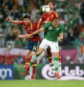 14 June 2012; Jonathan Walters, Republic of Ireland, in action against Xabi Alonso, left, and Sergio Ramos, Spain. EURO2012, Group C, Spain v Republic of Ireland, Arena Gdansk, Gdansk, Poland. Picture credit: David Maher / SPORTSFILE