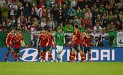 14 June 2012; A dejected James McClean, Republic of Ireland, as Spain players celebrate after Cesc Fàbregas scored their side's fourth goal on eighty three minutes. EURO2012, Group C, Spain v Republic of Ireland, Arena Gdansk, Gdansk, Poland. Picture credit: Stephen McCarthy / SPORTSFILE