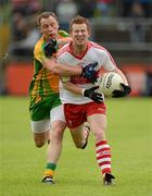 16 June 2012; Enda Lynn, Derry, in action against Anthony Thompson, Donegal. Ulster GAA Football Senior Championship Quarter-Final, Donegal v Derry, MacCumhaill Park, Ballybofey, Co. Donegal. Picture credit: Oliver McVeigh / SPORTSFILE