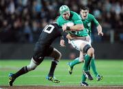 23 June 2012; Dan Touhy, Ireland, is tackled by Aaron Cruden, New Zealand. Steinlager Series 2012, 3rd Test, New Zealand v Ireland, Waikato Stadium, Hamilton, New Zealand. Picture credit: Ross Setford / SPORTSFILE