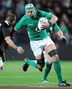 23 June 2012; Dan Touhy, Ireland, is tackled by Aaron Cruden, New Zealand. Steinlager Series 2012, 3rd Test, New Zealand v Ireland, Waikato Stadium, Hamilton, New Zealand. Picture credit: Ross Setford / SPORTSFILE