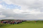 28 June 2012; Rory McIlroy watches his putt on the 4th green during the 2012 Irish Open Golf Championship. Royal Portrush, Portrush, Co. Antrim. Picture credit: Matt Browne / SPORTSFILE