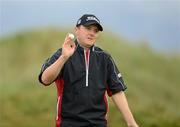 28 June 2012; Michael Hoey acknowledges the crowd after his putt on the 16th Green, during the 2012 Irish Open Golf Championship. Royal Portrush, Portrush, Co. Antrim. Picture credit: Oliver McVeigh / SPORTSFILE