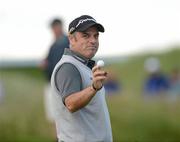28 June 2012; Paul McGinley acknowleges the crowd after his putt on the 16th Green during the 2012 Irish Open Golf Championship. Royal Portrush, Portrush, Co. Antrim. Picture credit: Oliver McVeigh / SPORTSFILE