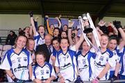 30 June 2012; Waterford captain Ciara Hurley, centre, lifts the cup alongside her team-mates. All-Ireland U14 'B' Ladies Football Championship Final 2012, Cavan v Waterford, St Brendan’s Park, Birr, Co. Offaly. Picture credit: David Maher / SPORTSFILE