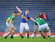 30 June 2012; Brian Fox, Tipperary, in action against Nigel Dunne, left, and Alan Mulhall, Offaly. GAA Football All-Ireland Senior Championship Qualifier Round 1, Tipperary v Offaly, Semple Stadium, Thurles, Co. Tipperary. Picture credit: Ray Lohan / SPORTSFILE