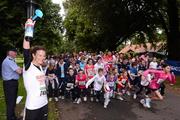 1 July 2012; Sonia O'Sullivan presses an air horn to signal the start of the race at the Athletics Ireland Family Fitness Festival 2012. Farmleigh House, Phoenix Park, Dublin. Picture credit: David Maher / SPORTSFILE