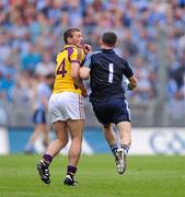 1 July 2012;  Dublin goalkeeper Stephen Cluxton collides with John Leacy, Wexford, on his way back to his goal area after taking a free. Leinster GAA Football Senior Championship Semi-Final, Dublin v Wexford, Croke Park, Dublin. Picture credit: David Maher / SPORTSFILE