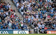 1 July 2012; Kevin McManamon ties his laces seconds after scoring the second Dublin goal. Supporters in the stand applaud the score.  Leinster GAA Football Senior Championship Semi-Final, Dublin v Wexford, Croke Park, Dublin. Picture credit: Ray McManus / SPORTSFILE
