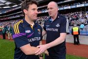 1 July 2012; Dublin manager Pat Gilroy, right, shakes hands with Wexford manager Jason Ryan at the end of the game. Leinster GAA Football Senior Championship Semi-Final, Dublin v Wexford, Croke Park, Dublin. Picture credit: David Maher / SPORTSFILE