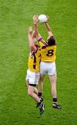 1 July 2012; Wexford players Eric Bradley, left, and Daith’ Waters, complete for a high ball against each other. Leinster GAA Football Senior Championship Semi-Final, Dublin v Wexford, Croke Park, Dublin. Picture credit: Dáire Brennan / SPORTSFILE