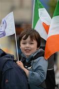 5 July 2012; Oliver Young, age 4, from Kileormac / Killoughy, Co. Offaly, accompanied by his father Richard, not pictured, watches on during the Féile na nGael Átha Cliath 2012 Parade. The Féile na nGael takes place in Dublin this weekend, with Under 14 hurling and camogie teams from around the world competing in the competition, and the finals taking place in Croke Park on Saturday. O'Connell Street, Dublin. Picture credit: Ray McManus / SPORTSFILE