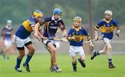 6 July 2012; Paddy Flaherty, Kilmacud Crokes, in action against Patrickswell players, from left, Jamie Dillon, Joshua Considine and Danny Harty. Féile na nGael Átha Cliath 2012, Division 1, Group D, Kilmacud Crokes, Dublin v Patrickswell, Limerick, Pairc Naomh Uinsionn, Marino, Dublin. Picture credit: Stephen McCarthy / SPORTSFILE