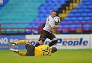 6 July 2012; Michael Rafter, Dundalk, chips the ball over Chris Bennion, Shelbourne. Airtricity League Premier Division, Shelbourne v Dundalk, Tolka Park, Dublin. Picture credit: Barry Cregg / SPORTSFILE