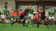 28 September 2002; Brian O'Driscoll of Ireland offloads to Kevin Maggs, under pressure from Kakha Alania of Georgia during the Rugby World Cup 2003 Qualifier match between Ireland and Georgia at Lansdowne Road in Dublin. Photo by Brendan Moran/Sportsfile