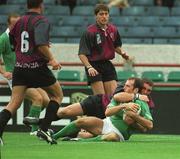 28 September 2002; Girvan Dempsey of Ireland is tackled by Ilia Zedguinidze of Georgia on his way to scoring his side's fourth try during the Rugby World Cup 2003 Qualifier match between Ireland and Georgia at Lansdowne Road in Dublin. Photo by Brendan Moran/Sportsfile