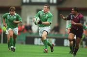 28 September 2002; Brian O'Driscoll of Ireland races clear of Kakha Alani of Georgia during the Rugby World Cup 2003 Qualifier match between Ireland and Georgia at Lansdowne Road in Dublin. Photo by Brendan Moran/Sportsfile