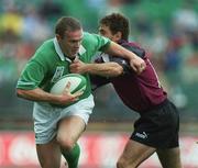 28 September 2002; Malcolm O'Kelly of Ireland is tackled by Malkhaz Urjukashbili of Georgia during the Rugby World Cup 2003 Qualifier match between Ireland and Georgia at Lansdowne Road in Dublin. Photo by Brendan Moran/Sportsfile