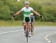 13 July 2012; Irish Junior Road Race Champion Ryan Mullen, Stena Line Ireland, celebrates as he approaches the finishline to take victory on Stage 4 of the 2012 Junior Tour of Ireland, Achill - Achill, Co. Mayo. Picture credit: Stephen McMahon / SPORTSFILE