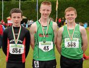 14 July 2012; Winner of the Boy's Under-14 75m Hurdles event,  Shane Mooney, Tireragh A.C., Co. Sligo, with second place David McDonald, Menapians A.C., Co. Wexford, left, and third place Luke Morris, Newbridge A.C., Co. Kildare, right. Woodie’s DIY Juvenile Track and Field Championships of Ireland, Tullamore Harriers Stadium, Tullamore, Co. Offaly. Picture credit: Tomas Greally / SPORTSFILE