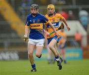 15 July 2012; Bill Maher, Tipperary, in action against Shane Taylor, Clare. Munster GAA Hurling Minor Championship Final, Tipperary v Clare, Pairc Ui Chaoimh, Cork. Picture credit: Ray McManus / SPORTSFILE