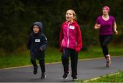 30 September 2017; Ohdran Golden, age 5 from Mallow, Cork, and Shona Costello, age 7 from Tuam, Galway, during the Ballincollig parkrun where Vhi hosted a special event to celebrate their partnership with parkrun Ireland. Former Cork GAA footballer Valerie Mulcahy was on hand to lead the warm up for parkrun participants before completing the 5km course alongside newcomers and seasoned parkrunners alike. Vhi provided walkers, joggers, runners and volunteers at Ballincollig parkrun with a variety of refreshments in the Vhi Relaxation Area at the finish line. A qualified physiotherapist Will Cuddihy was also available to guide participants through a post event stretching routine to ease those aching muscles. Parkruns take place over a 5km course weekly, are free to enter and are open to all ages and abilities, providing a fun and safe environment to enjoy exercise. To register for a parkrun near you visit www.parkrun.ie. New registrants should select their chosen event as their home location. You will then receive a personal barcode which acts as your free entry to any parkrun event worldwide. The Regional Park, Ballincollig, Co Cork. Photo by Eóin Noonan/Sportsfile