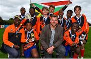 1 October 2017; Blackrock Rugby Club hosted a team of under 13 year old boys from the townships and disadvantaged areas of Johannesburg in South Africa. The boys, most of whom come from some of the poorest areas in Johannesburg, participated in the Blackrock College RFC 7’s under 13’s rugby tournament. Pictured is Leinster and Ireland international Jordi Murphy with the Tshuma Stingers team. Photo by Ramsey Cardy/Sportsfile