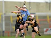 28 July 2012; Mairi Moynihan, Dublin, in action against Mairead Power, left, and Aoife Neary, Kilkenny. All-Ireland Senior Camogie Championship, Quarter-Final Qualifier, Dublin v Kilkenny, O'Moore Park, Portlaoise, Co. Laois. Picture credit: Pat Murphy / SPORTSFILE