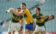 28 July 2012; Gary Brennan, Clare, in action against Anthony Maher, left, Aidan O'Mahony, centre, and Donnchadh Walsh, Kerry. GAA Football All-Ireland Senior Championship Qualifier, Round 4, Kerry v Clare, Gaelic Grounds, Limerick. Picture credit: Diarmuid Greene / SPORTSFILE