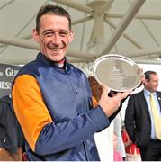 2 August 2012; Jockey Davy Russell holds up the plate after he rode Rebel Fitz to victory in the Guinness Galway Hurdle Handicap. Galway Racing Festival 2012, Ballybrit, Galway. Picture credit: Barry Cregg / SPORTSFILE