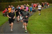 14 October 2017; Runners during the Malahide parkrun where Vhi ambassador and Olympian David Gillick also took part as Vhi hosted a special event to celebrate their partnership with parkrun Ireland. David was on hand to lead the warm up for parkrun participants before completing the 5km course alongside newcomers and seasoned parkrunners alike. Vhi provided walkers, joggers, runners and volunteers at Malahide parkrun with a variety of refreshments in the Vhi Relaxation Area at the finish line. A qualified physiotherapist was also available to guide participants through a post event stretching routine to ease those aching muscles.  parkruns take place over a 5km course weekly, are free to enter and are open to all ages and abilities, providing a fun and safe environment to enjoy exercise. To register for a parkrun near you visit www.parkrun.ie. New registrants should select their chosen event as their home location. You will then receive a personal barcode which acts as your free entry to any parkrun event worldwide. Photo by Cody Glenn/Sportsfile