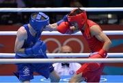 10 August 2012; Paddy Barnes, Ireland, left, exchanges punches with Shiming Zou, China, during their men's light fly 49kg semi-final contest. London 2012 Olympic Games, Boxing, South Arena 2, ExCeL Arena, Royal Victoria Dock, London, England. Picture credit: Stephen McCarthy / SPORTSFILE