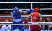 10 August 2012; Paddy Barnes, Ireland, left, exchanges punches with Shiming Zou, China, during their men's light fly 49kg semi-final contest. London 2012 Olympic Games, Boxing, South Arena 2, ExCeL Arena, Royal Victoria Dock, London, England. Picture credit: Stephen McCarthy / SPORTSFILE