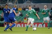 15 August 2012; Shane Ferguson, Northern Ireland, in action against Kari Arkivuo, Finland. Vauxhall International Challenge Match, Northern Ireland v Finland, Windsor Park, Belfast, Co. Antrim. Picture credit: Oliver McVeigh / SPORTSFILE