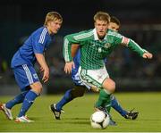 15 August 2012; Steve Davis, Northern Ireland, in action against Niklas Moisander, left, and Roman Eremenko, Finland. Vauxhall International Challenge Match, Northern Ireland v Finland, Windsor Park, Belfast, Co. Antrim. Picture credit: Oliver McVeigh / SPORTSFILE