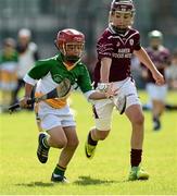 26 August 2012; James Hayes, Shinrone and Coolderry, Co. Offaly, in action against Shane Quike, Athenry, Co. Galway, competing in the Hurling Boy's U-11 event. Community Games National Finals Weekend, Athlone, Co. Westmeath. Picture credit: David Maher / SPORTSFILE