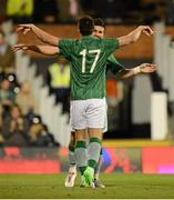 11 September 2012; Republic of Ireland's Shane Long, right, celebrates after scoring his side's first goal with team-mate Sean St Ledger. International Friendly, Republic of Ireland v Oman, Craven Cottage, Fulham, London, England. Picture credit: David Maher / SPORTSFILE