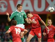 11 September 2012; Gareth McAuley, Northern Ireland, in action against Ante Bukvic, Luxembourg. 2014 FIFA World Cup Qualifier Group F, Northern Ireland v Luxembourg, Windsor Park, Belfast, Co. Antrim. Picture credit: Oliver McVeigh / SPORTSFILE